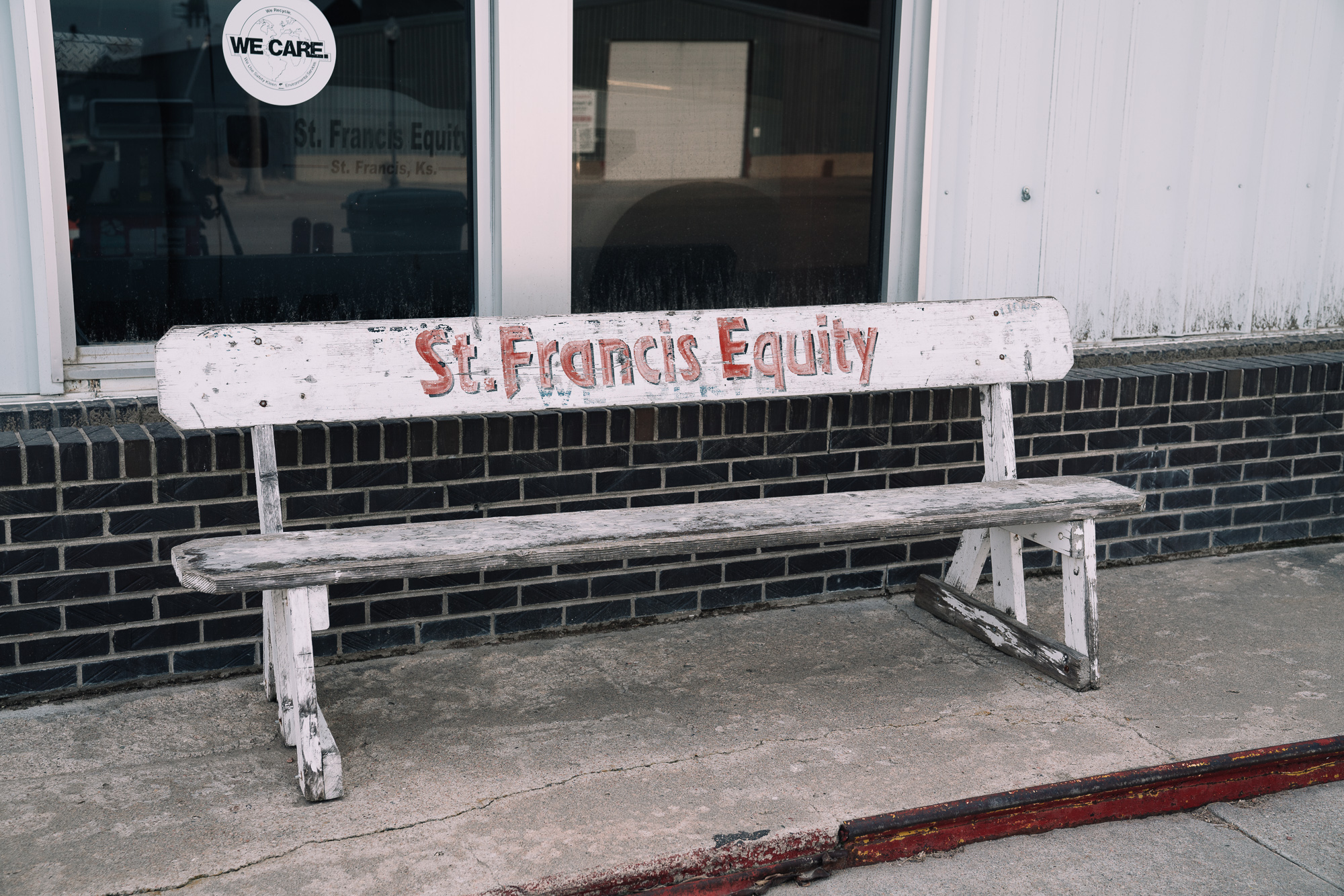 white bench with St. Francis written on it