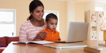 mother and child using a laptop computer together